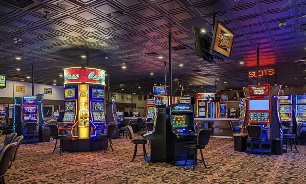 Casino floor with multiple slot machines arranged across a gaming hall