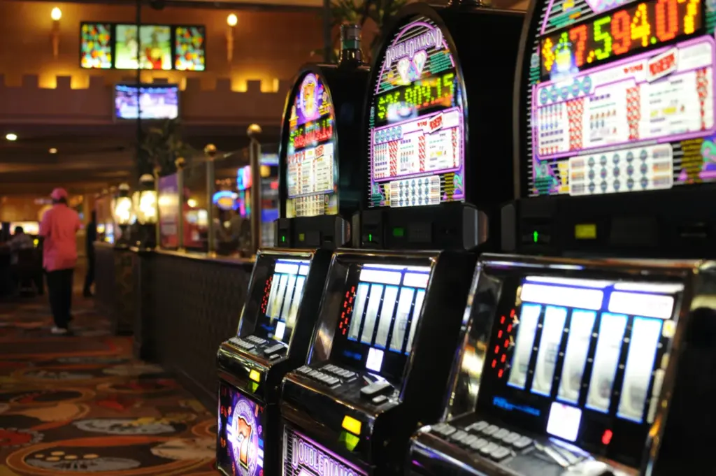 Casino slot machines shown in a row, representing the slot-focused play used in free-spins promotions